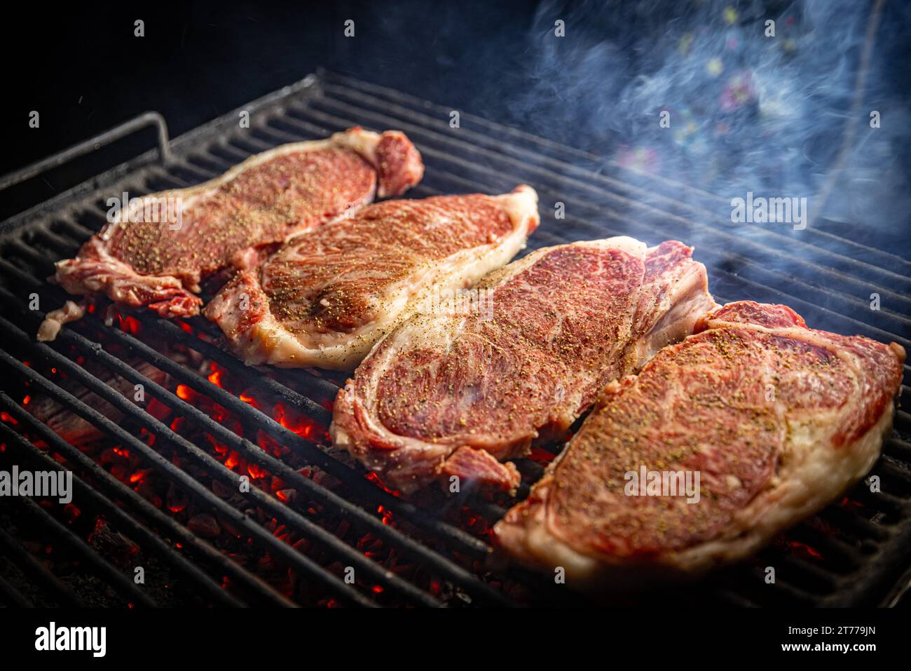 Wagyu entrecote beef steak on the charcoal bbq grill Stock Photo - Alamy