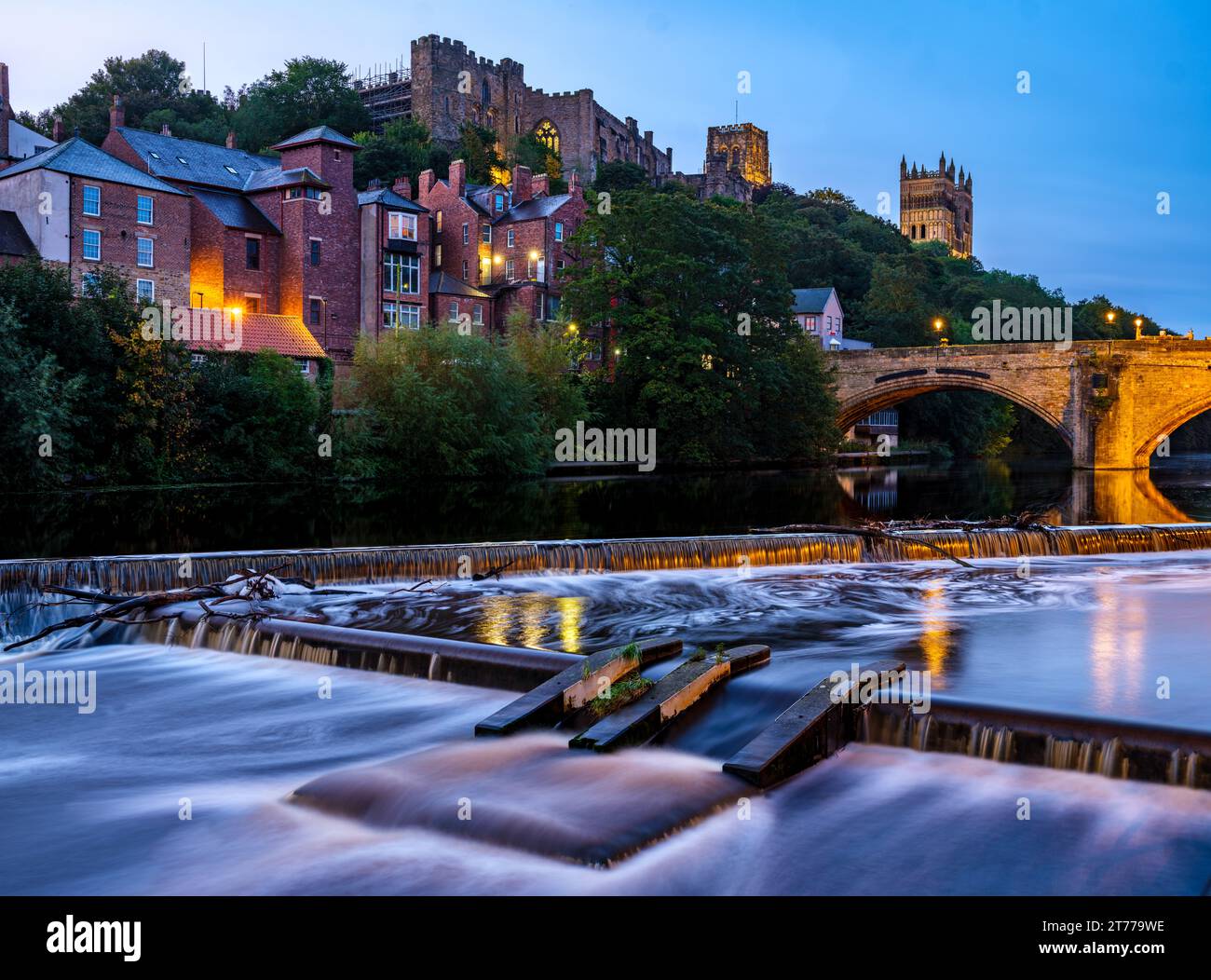 Long exposure of wier,and Framwellgate Bridge in Durham during the morning blue ehour with city lights on Stock Photo