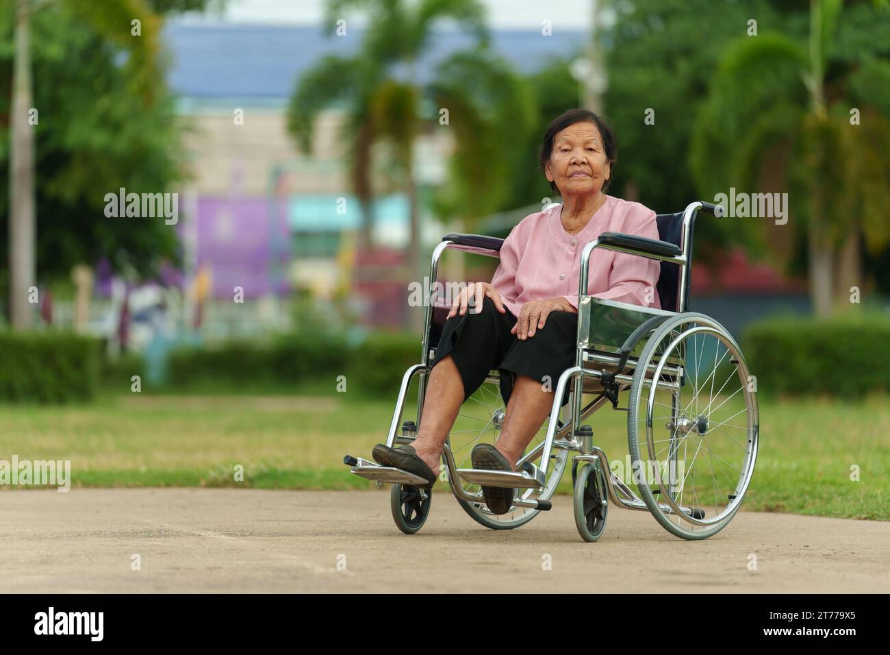 Old lonely woman in wheelchair hi-res stock photography and images - Alamy