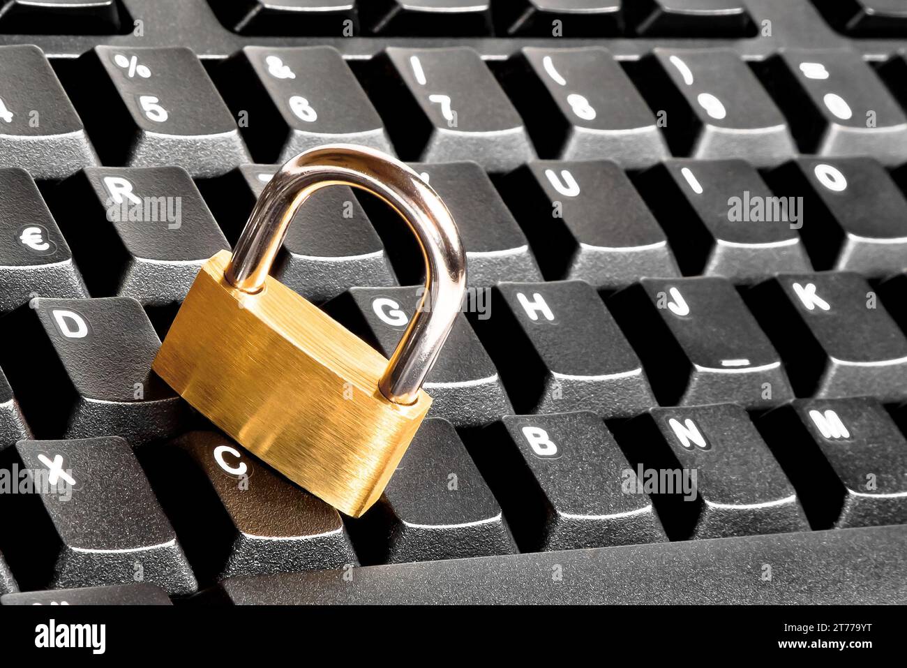 detail of a lock security on black keyboard. computer security concept Stock Photo