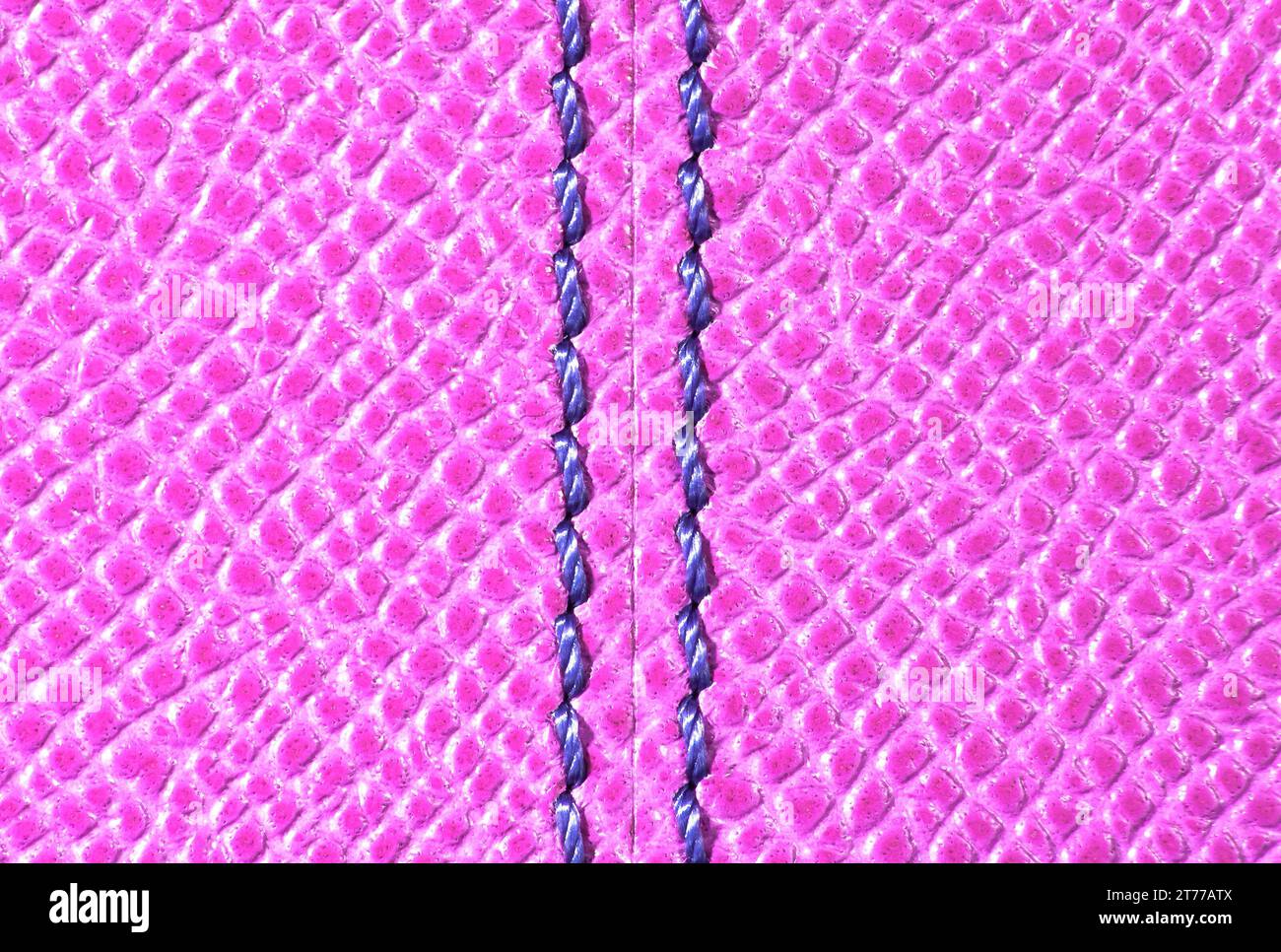 pink leather texture with blue stitching for background Stock Photo