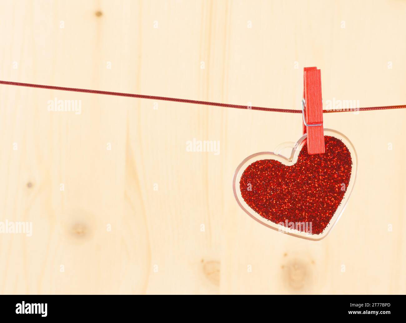 valentine day series, decorative red heart hanging on wood background ...