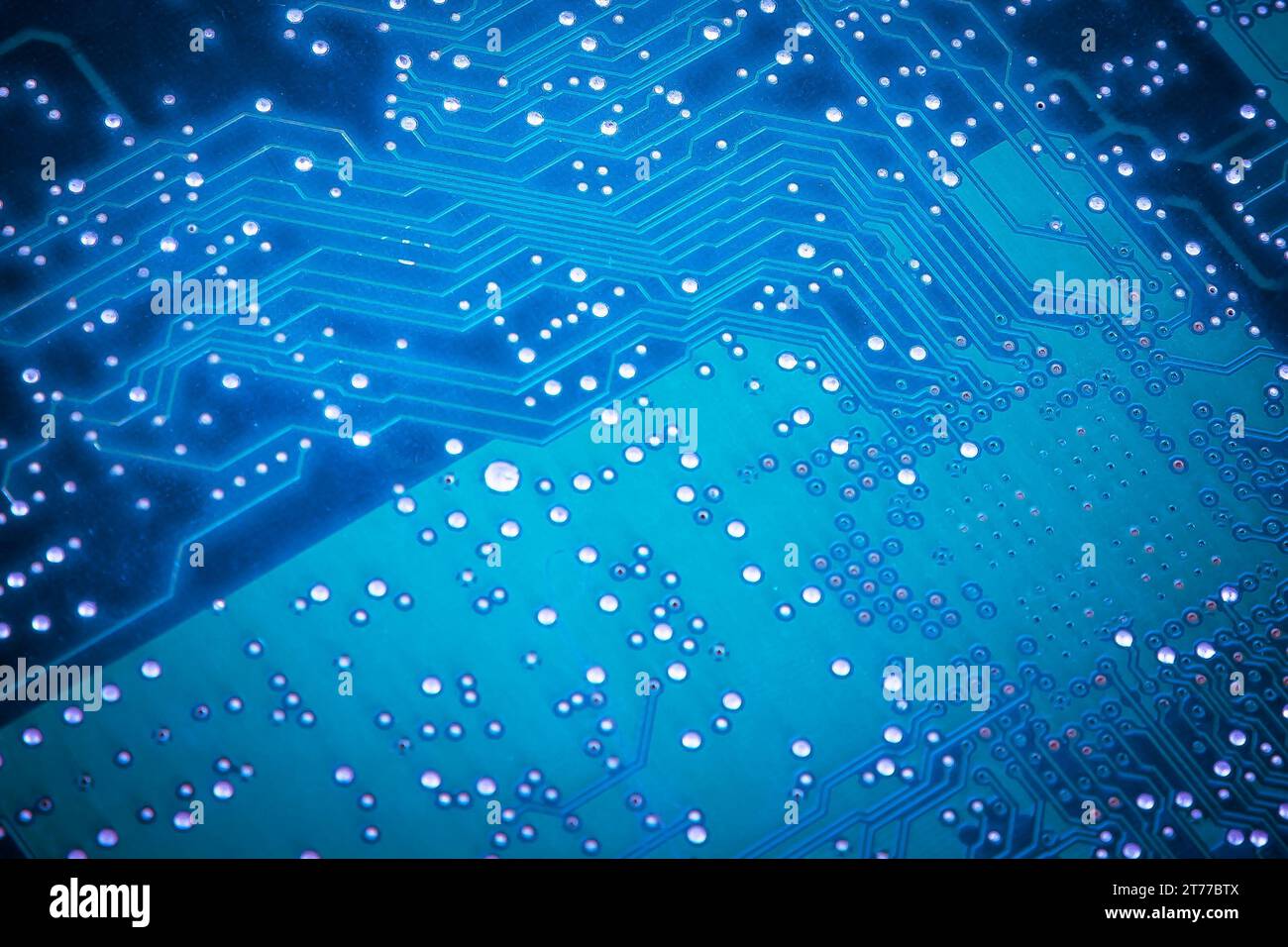macro shot of the back side of a blue circuit board Stock Photo