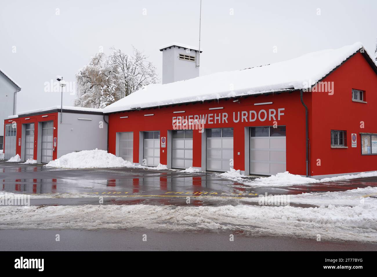 Fire department building Urdorf with an inscription in German language. Stock Photo