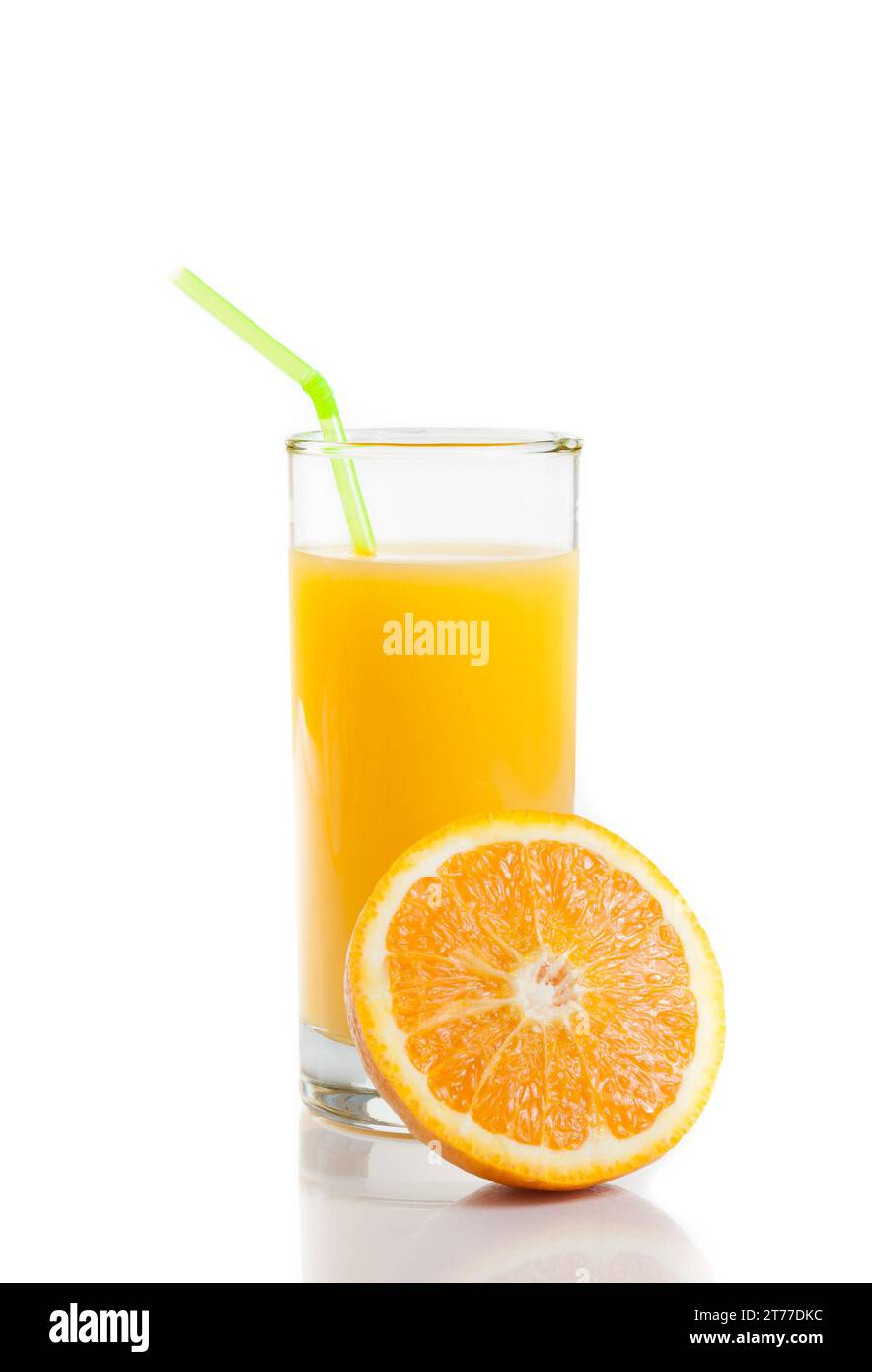 full glass of orange juice with straw near half orange on white background Stock Photo
