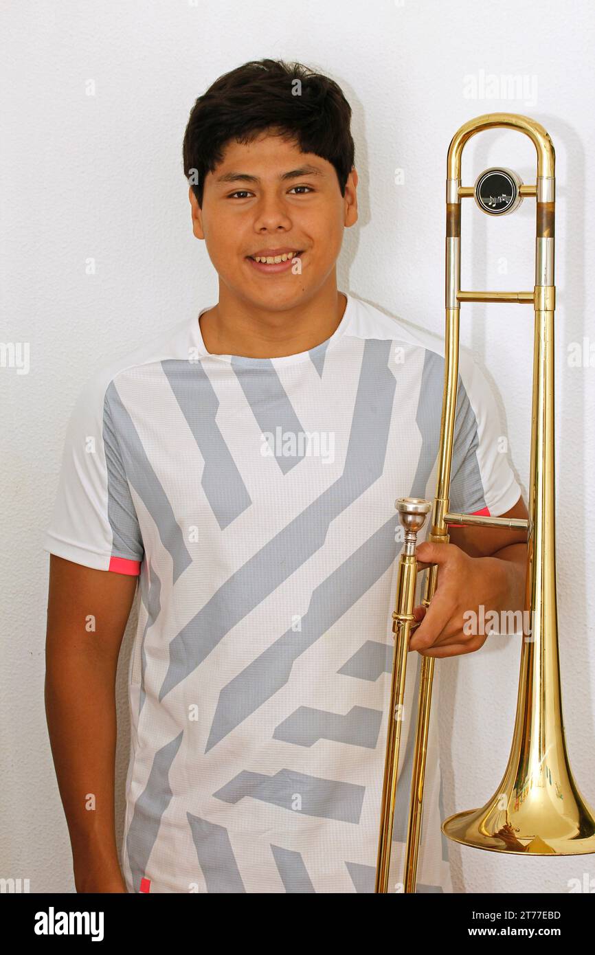 Boy with trombone Stock Photo Alamy