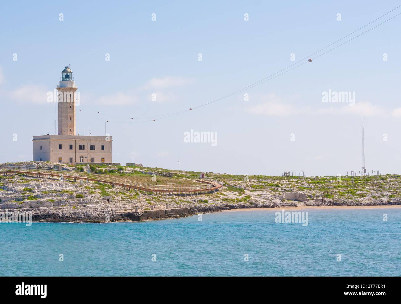a lighthouse in the beautiful sunny day with clouds in Vieste Italy; a lighthouse in the beautiful sunny day with clouds in Vieste Italy Stock Photo