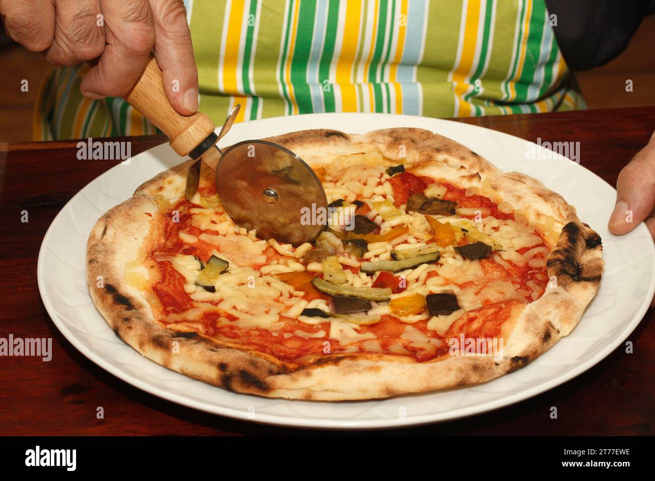 Cutting pizza. Stock Photo