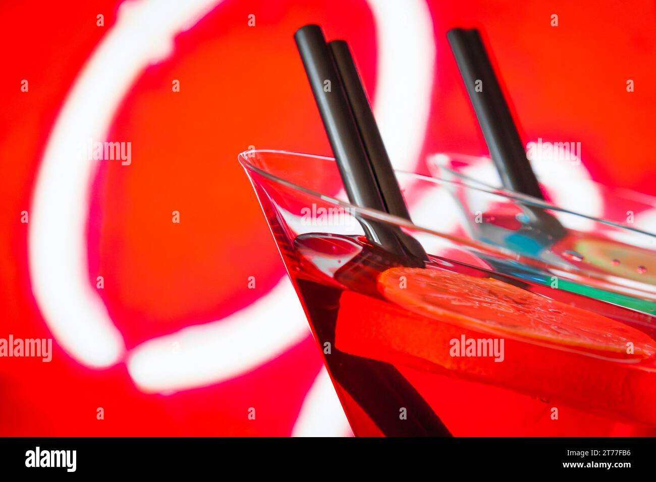 https://c8.alamy.com/comp/2T77FB6/detail-of-red-cocktail-with-neon-background-with-space-for-text-dance-disco-concept-2T77FB6.jpg