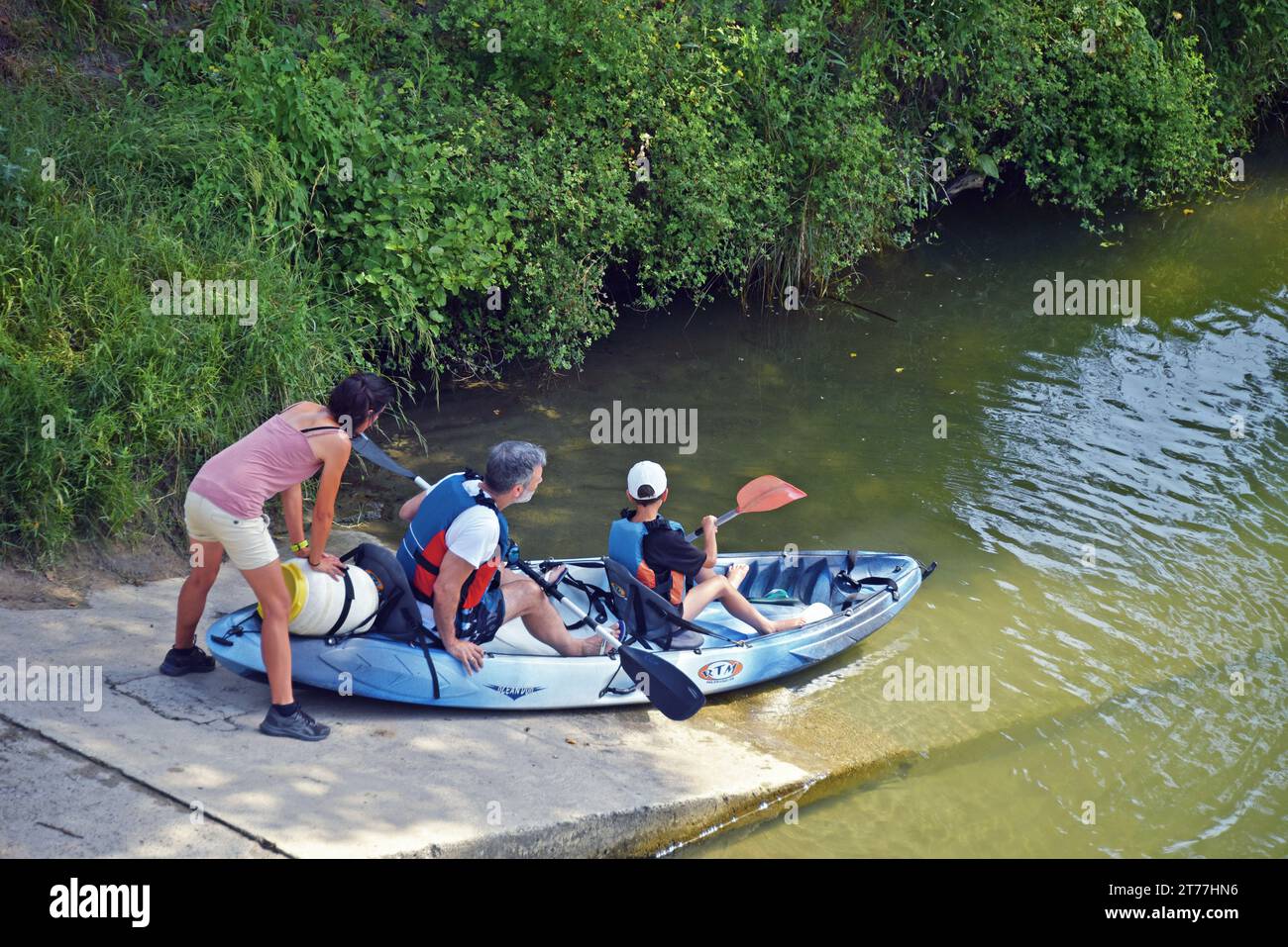 familiy with kayak in the river the Tavignano, France, Corsica, Aleria Stock Photo