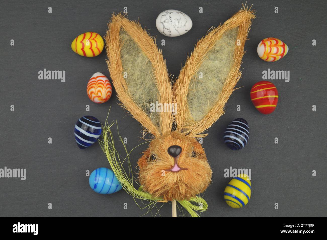Easter bunny with Easter eggs on gray underground Stock Photo - Alamy