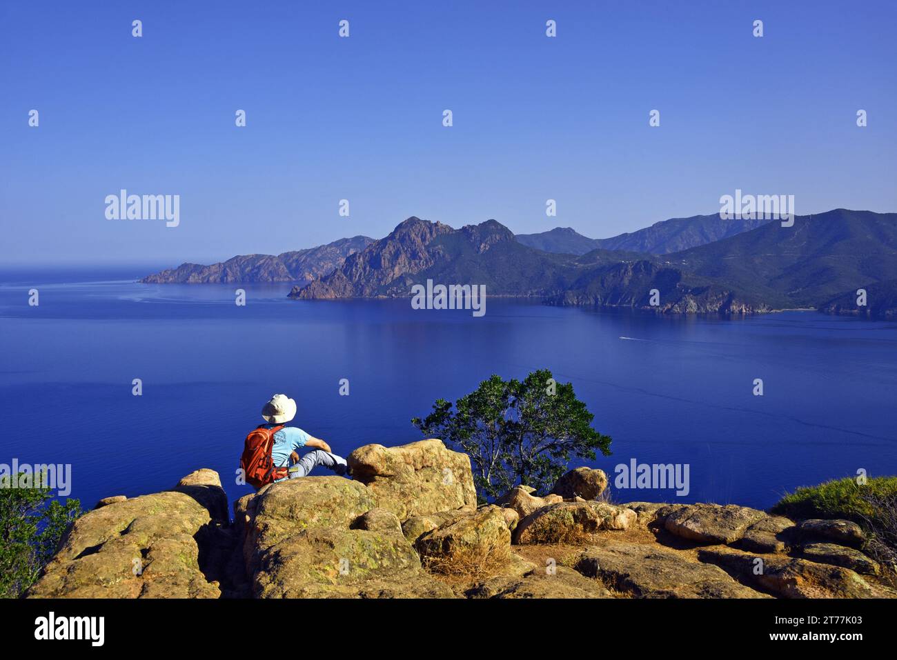 wanderer the view point called the Chateau Fort, footpath in the Calanche of Piana, France, Corsica, Golfe de Porto Stock Photo