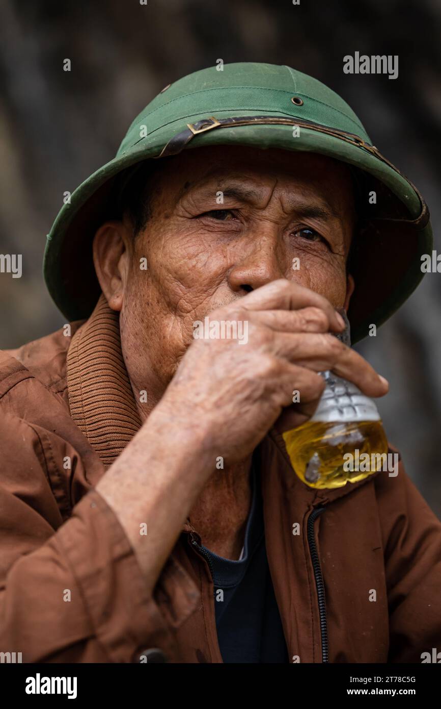 Vietnamese Man is relaxing after work Stock Photo