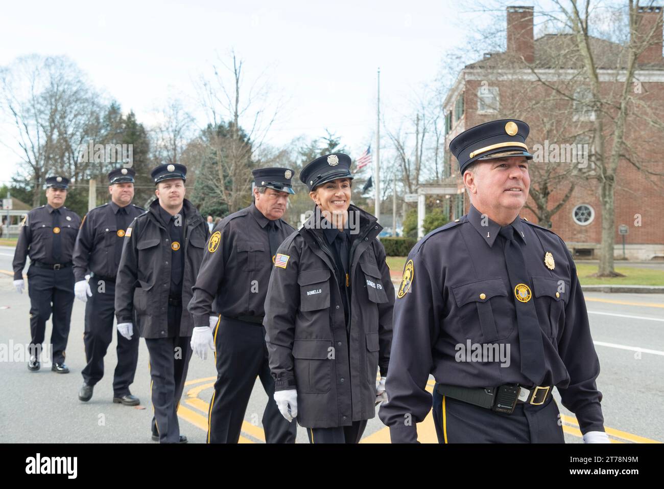 Members of the Somers Volunteer Fire Department march in the town's