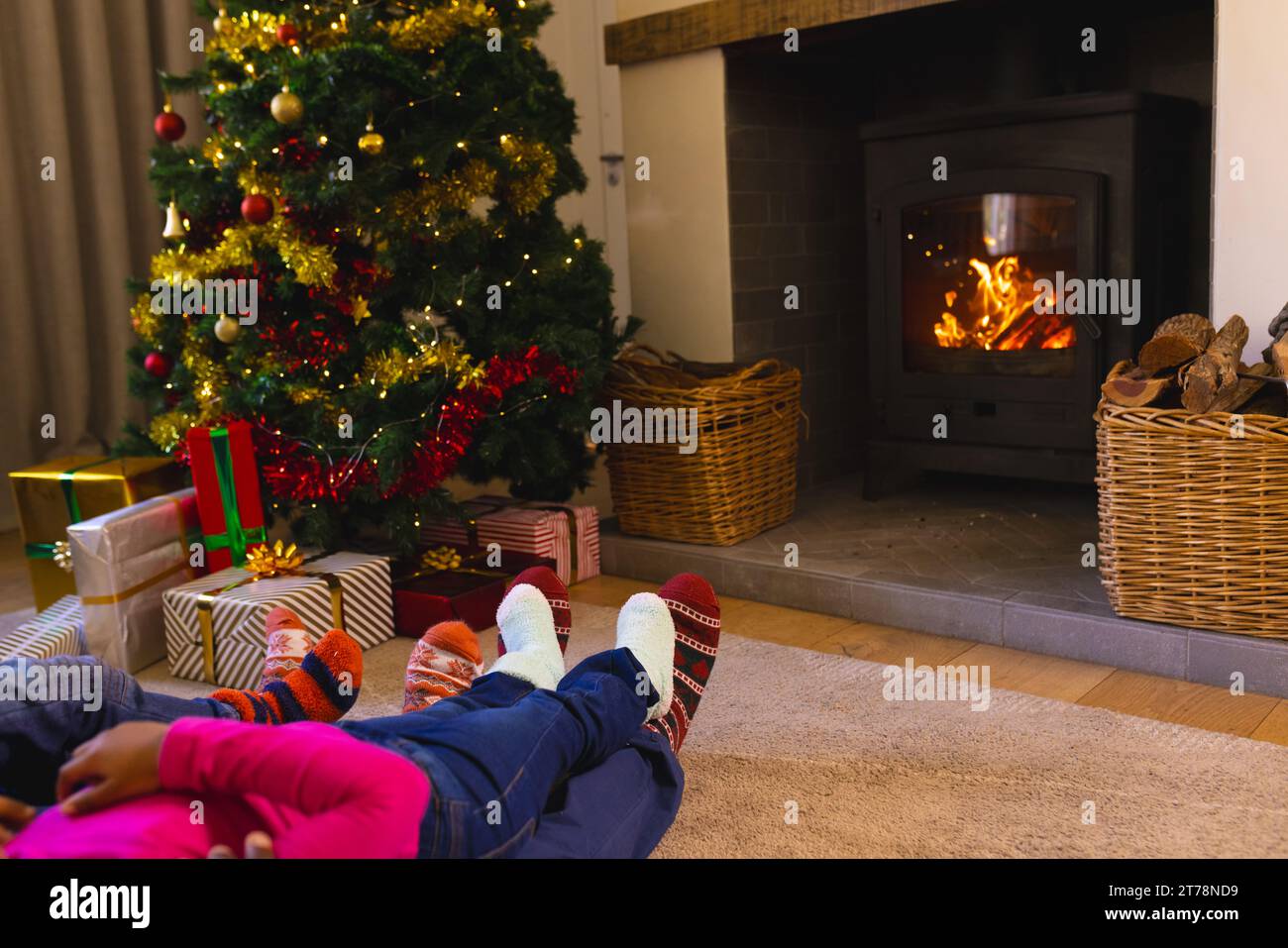 African american family spending time together in living room at christmas at home, copy space Stock Photo