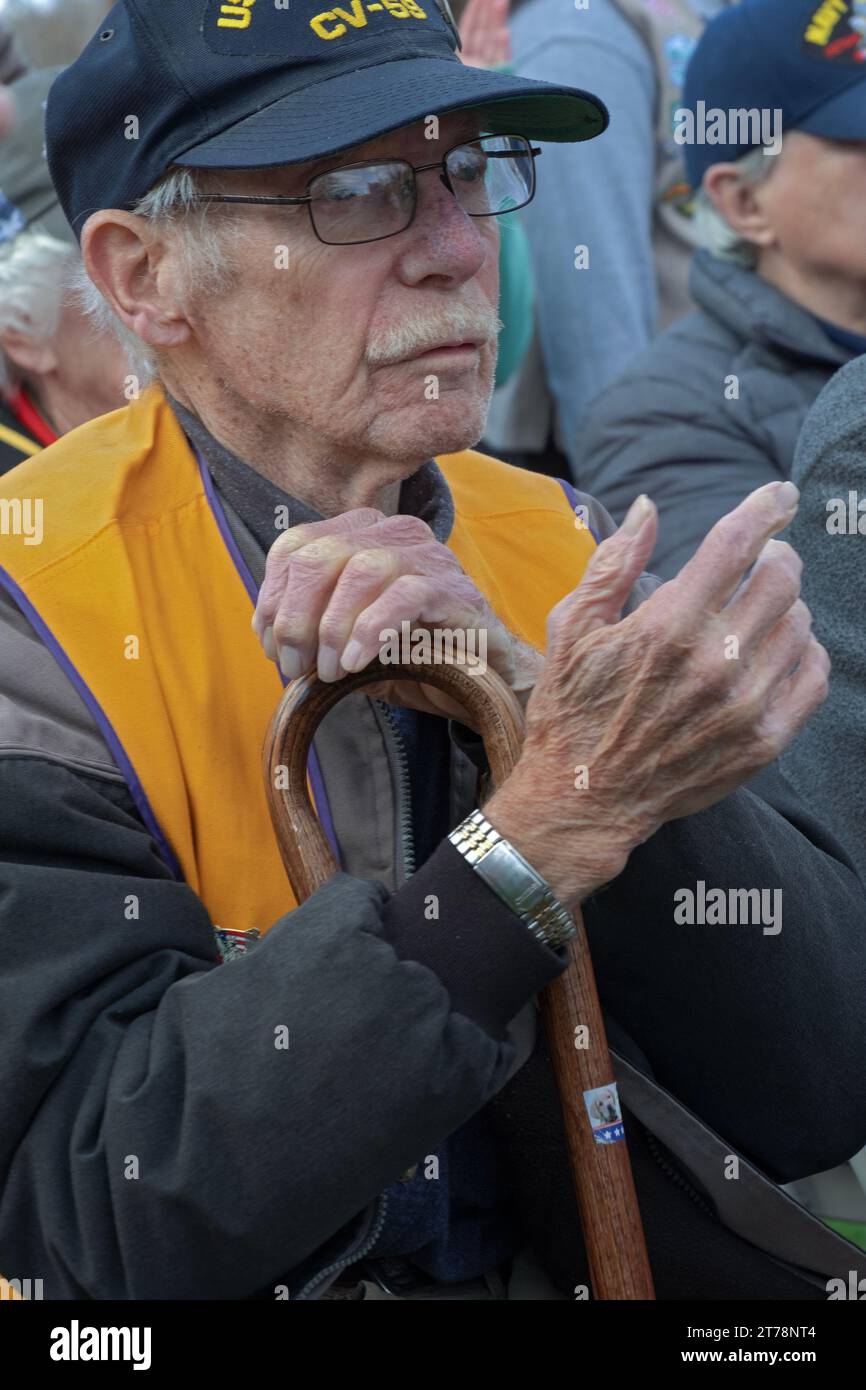 A US Army veteran listens to speeches at Invandell Cemetery at the conclusion of the 2023 Veterans Day Parade in Somers, New York. Stock Photo