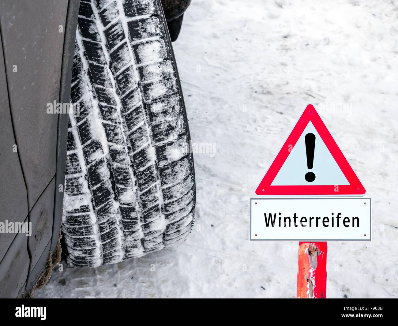 Warning sign for winter tires in winter in German Stock Photo