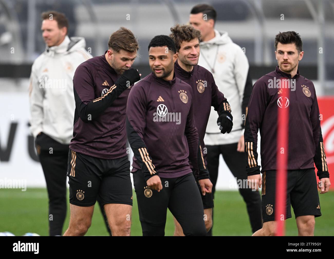 14 November 2023, Hesse, Frankfurt/Main: Soccer: National team, before the international match against Turkey and Austria. National team players Niclas Füllkrug (l-r), Serge Gnabry, Thomas Müller and Jonas Hofmann take part in national team training on the DFB campus in the presence of national team coach Julian Nagelsmann. Photo: Arne Dedert/dpa - IMPORTANT NOTE: In accordance with the regulations of the DFL German Football League and the DFB German Football Association, it is prohibited to utilize or have utilized photographs taken in the stadium and/or of the match in the form of sequential Stock Photo