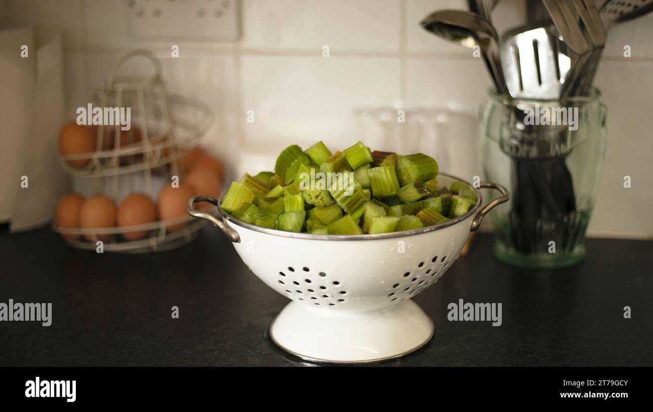 Rhubarb sliced up and cut into a colander ready for cooking Stock Photo