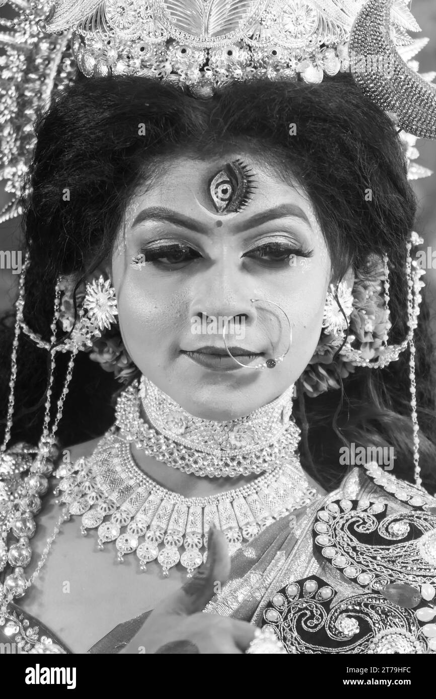 Portrait of beautiful Indian girl of Durga Idol Agomoni Concept Indoor