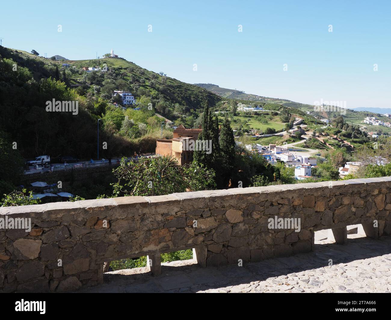 Promenade and suburbs near African Chefchaouen city in Morocco, clear blue sky in 2019 warm sunny spring day on April. Stock Photo