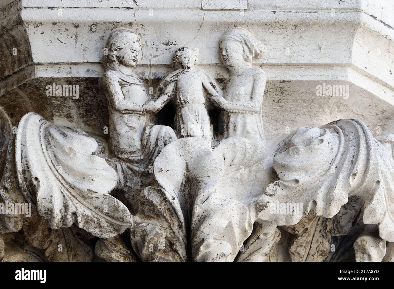 The Family: raising the child - Love, Marriage, Fathering and Death - Column capital of Palazzo Ducale (Doge's Palace, St Mark's Square) - Venice Stock Photo