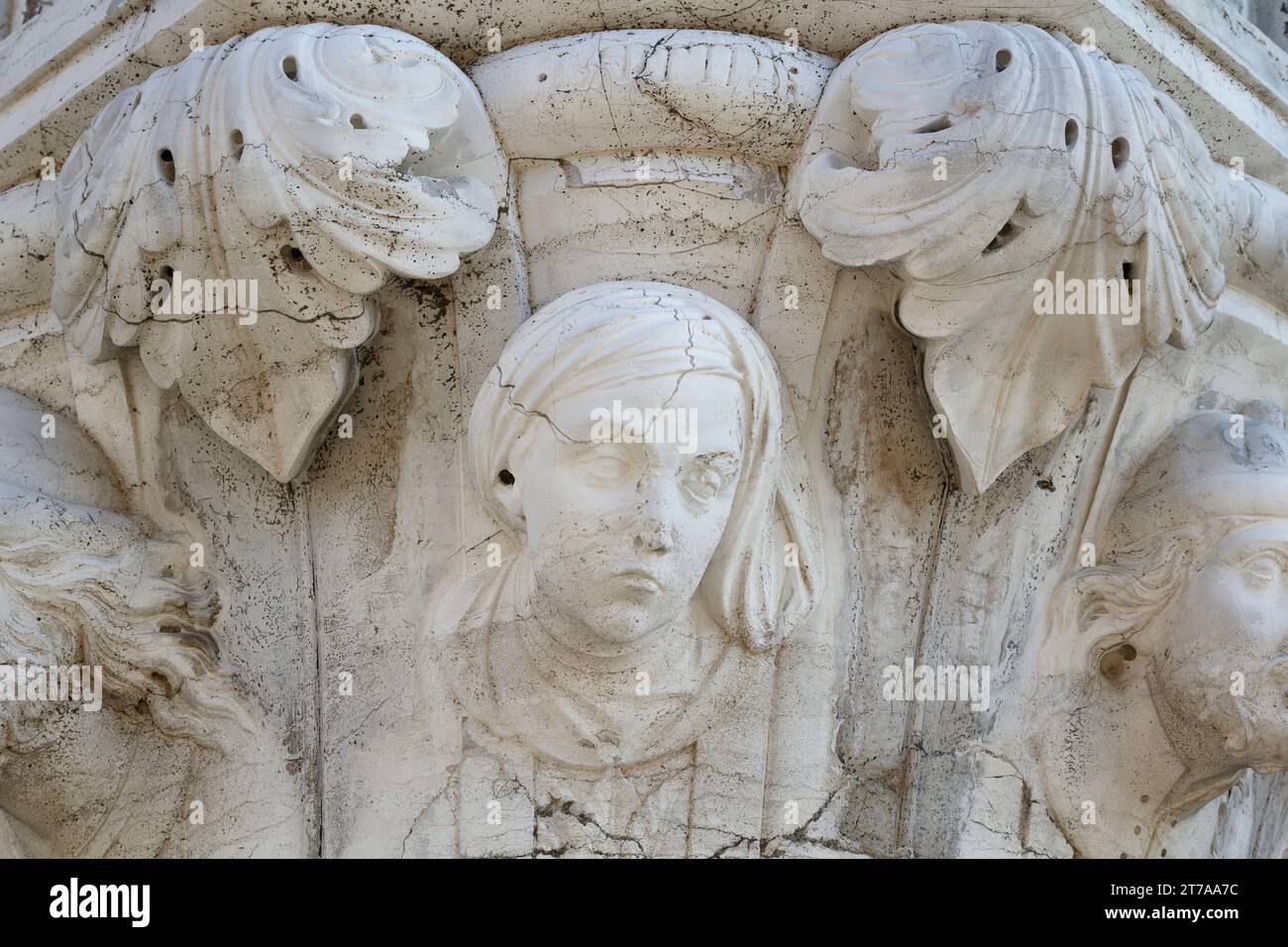 Latins - People of the World: how to recognize a stranger in the ancient Venice - Column capital of Palazzo Ducale (Doge's Palace, St Mark's Square) Stock Photo