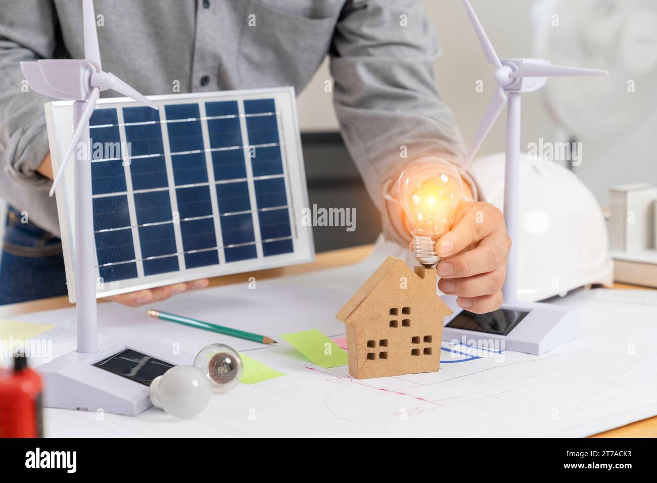 Architect working design apply renewable green energy. Stock Photo