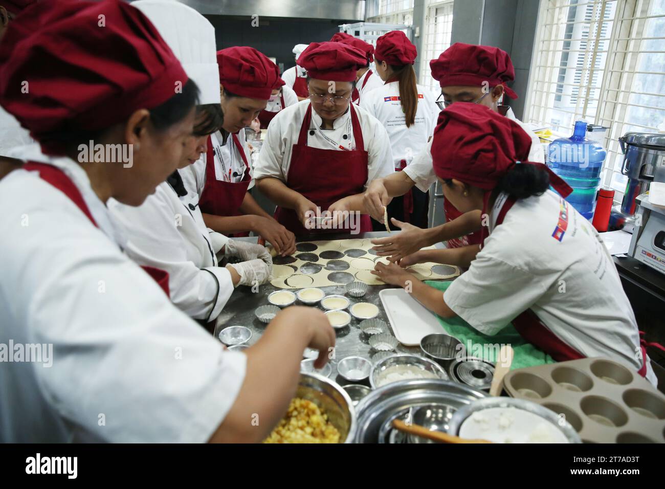 Yangon, Myanmar. 13th Nov, 2023. Students make desserts during a bakery