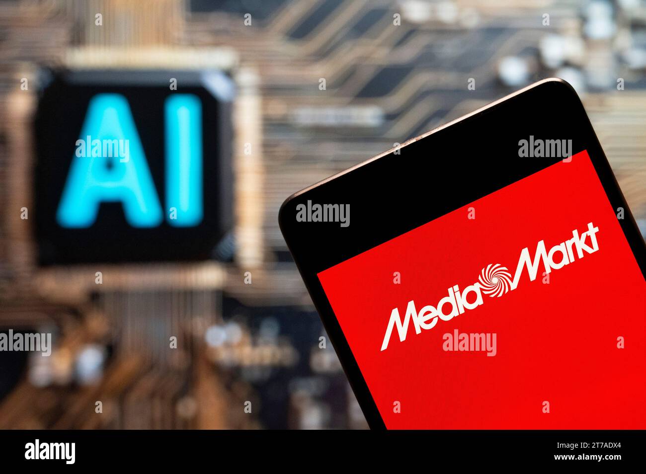 In this photo illustration, the German electronics multinational chain of stores Media Markt logo seen displayed on a smartphone with an Artificial intelligence (AI) chip and symbol in the background. Stock Photo