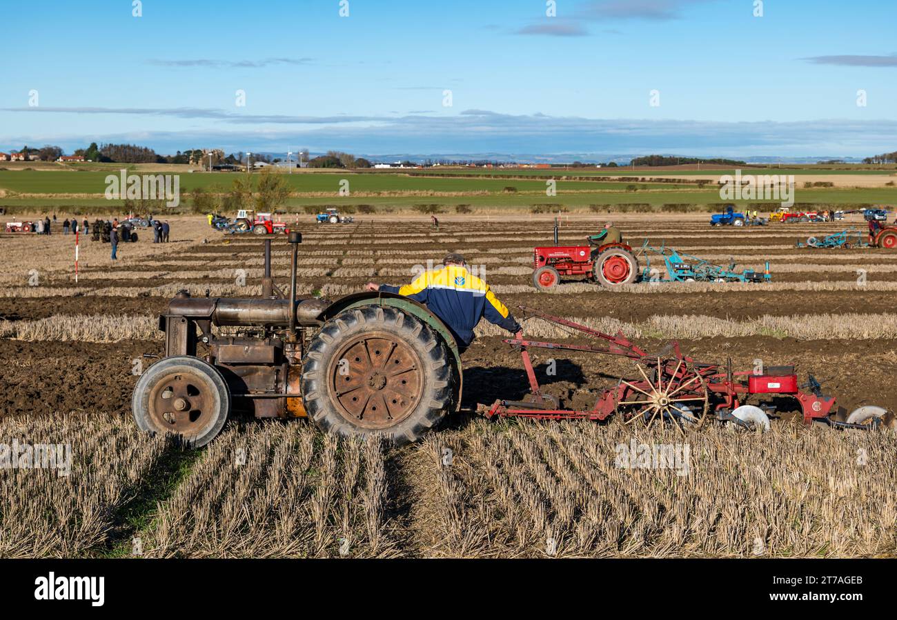 Vintage Fordson tractor ploughing furrows in ploughing match, East Lothian, Scotland, UK Stock Photo