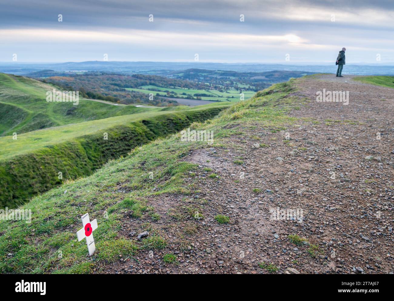 Malvern Hills,Worcestershire,England,UK-November 11 2023:On Armistice day,a memorial tribute,red poppy symbol,placed in the soil atop the ancient Hill Stock Photo