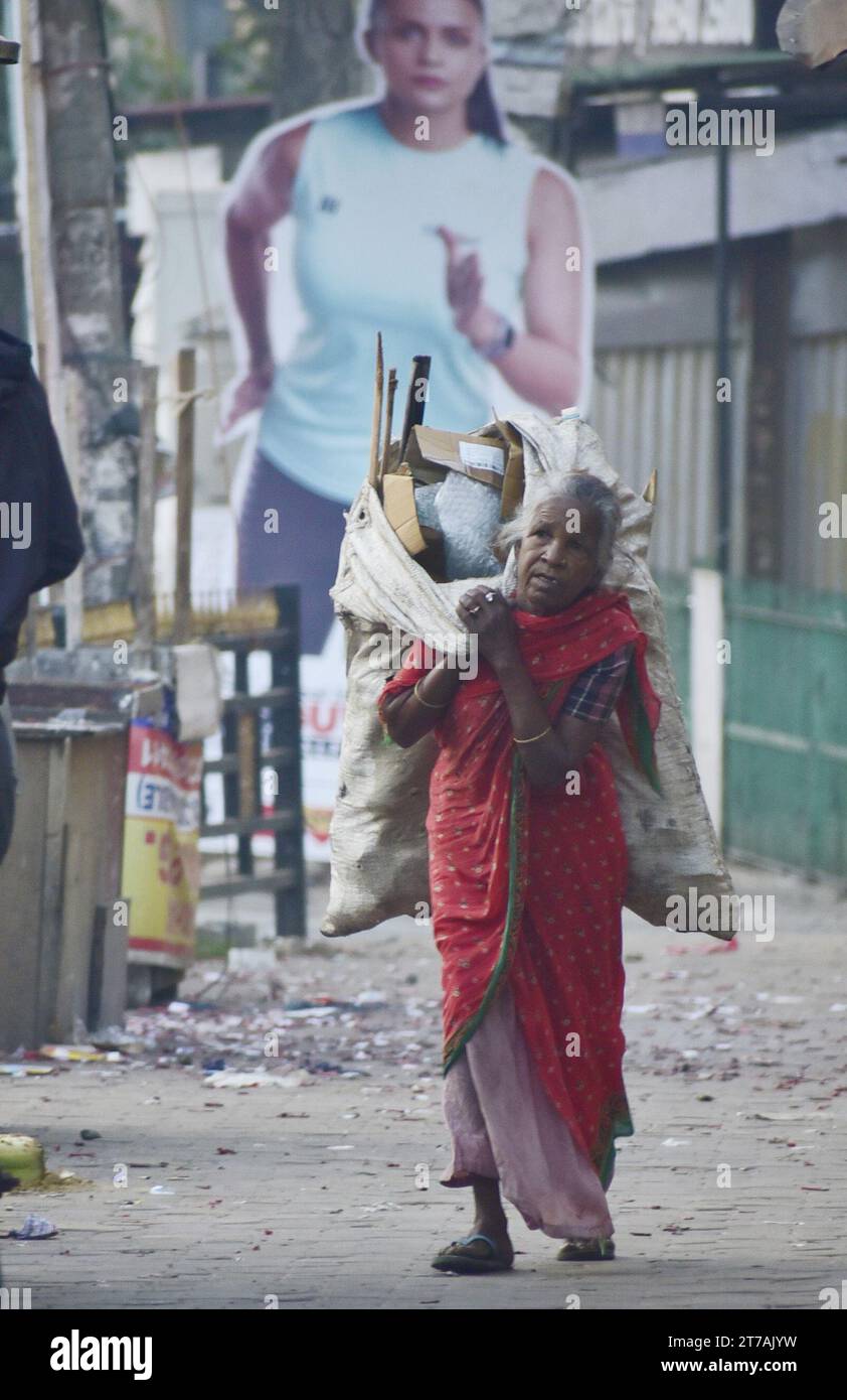 Guwahati, Guwahati, India. 14th Nov, 2023. A woman rags picker carry re