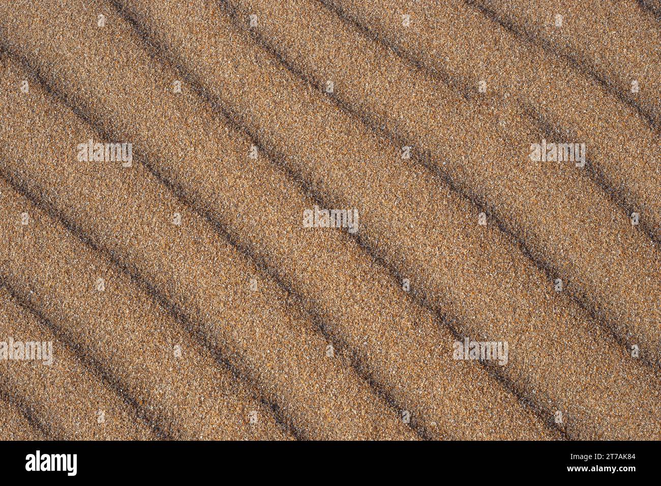 Sand texture with sand dunes. Pattern, natural background. Stock Photo
