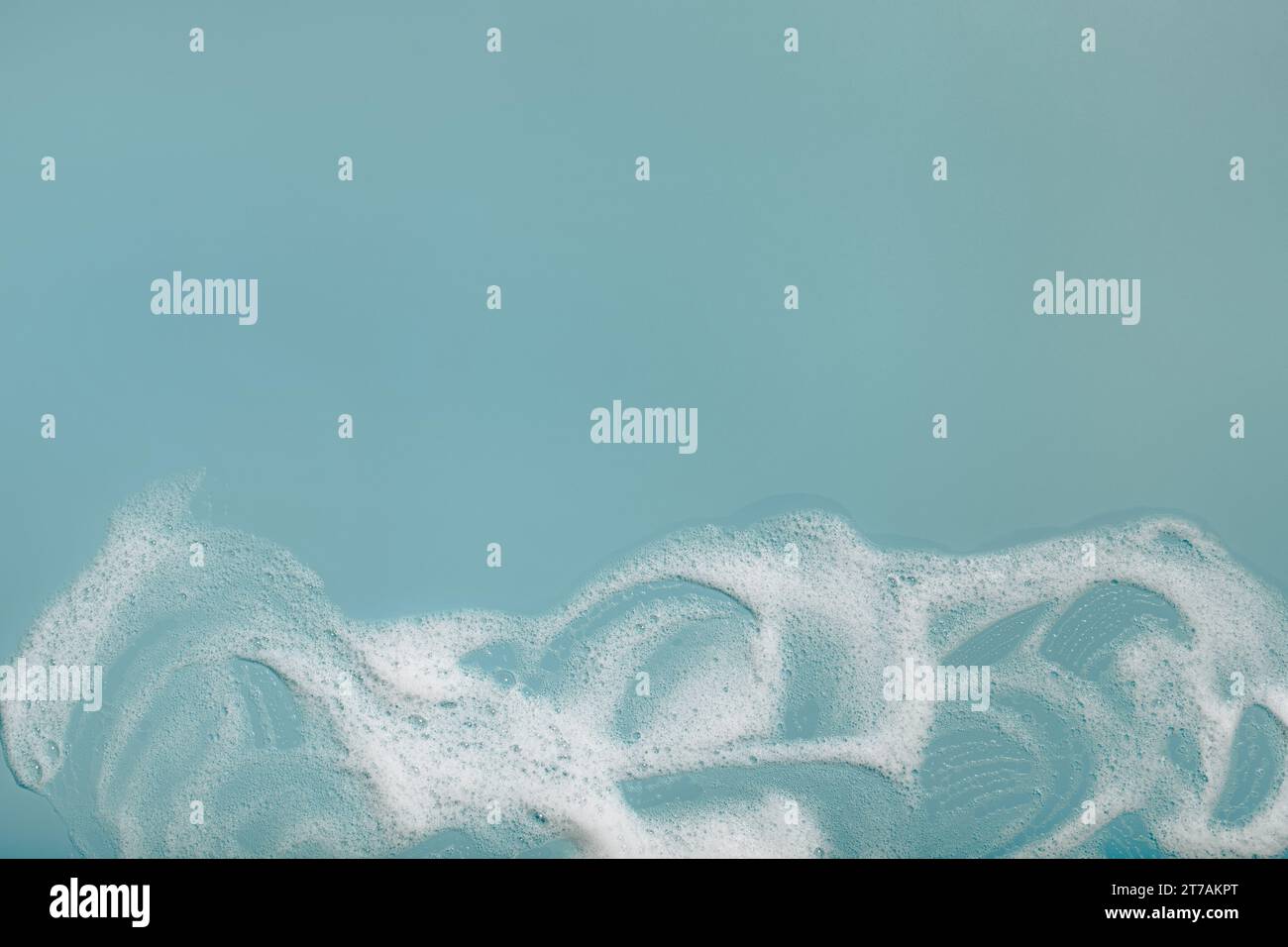 foam soap suds on green background, laundry cleaning washing concept Stock Photo