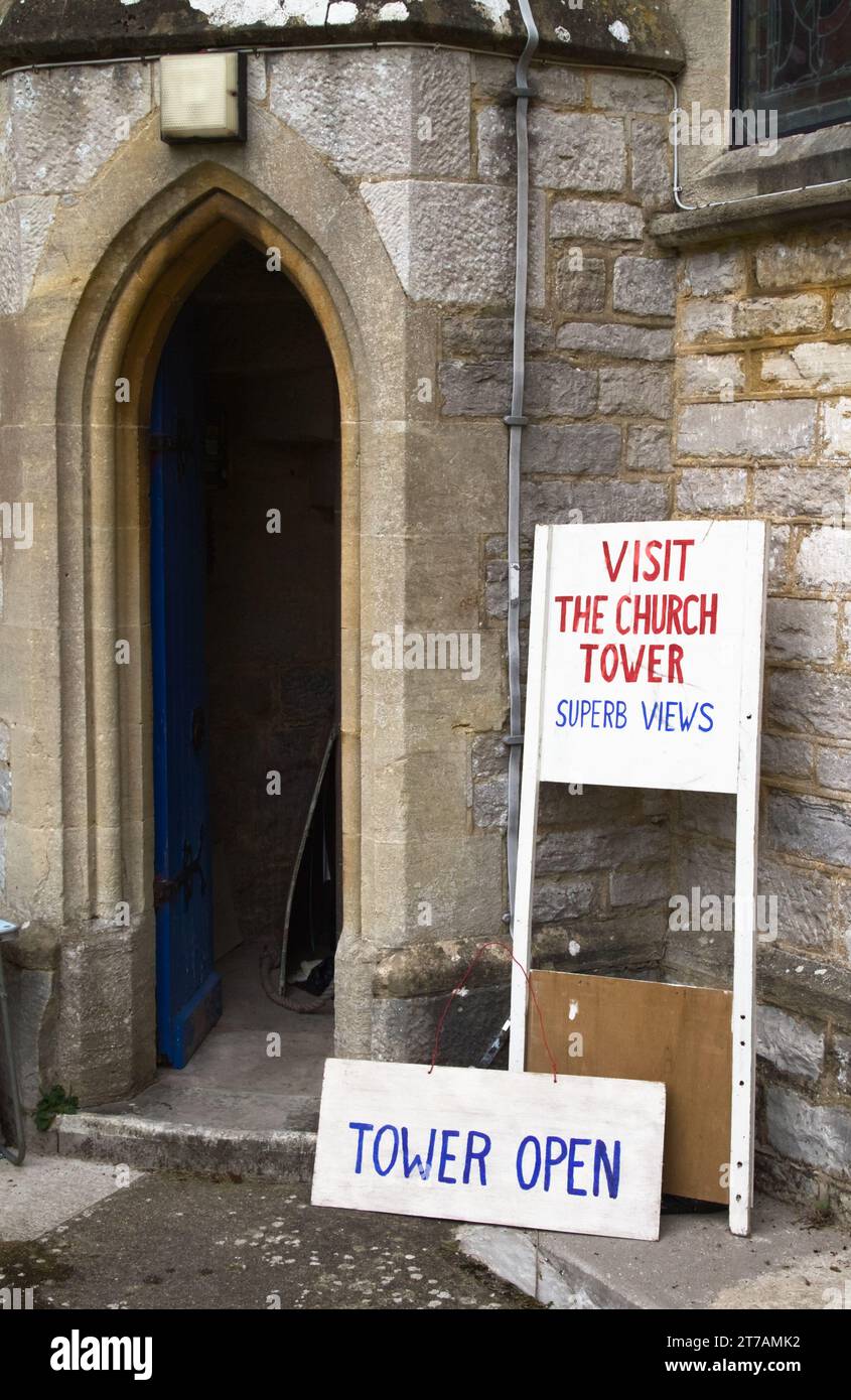Hand Painted Signs Advertising Visits At The Entrance Doorway To The Church Tower Of St Peters And St Pauls Parish Church, Ringwood, UK Stock Photo