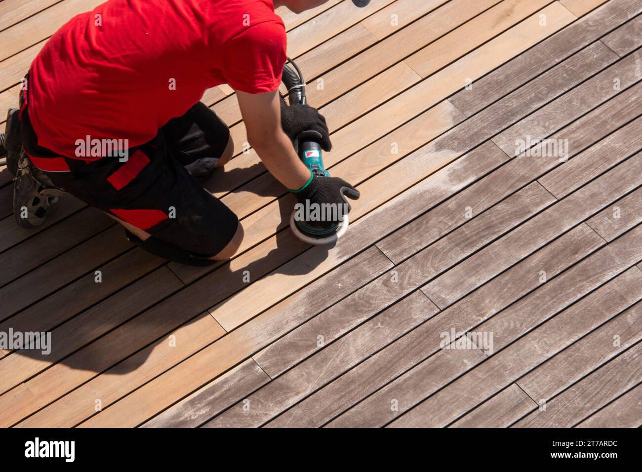 Cleaning the terrace with power sander professional deck cleaner on