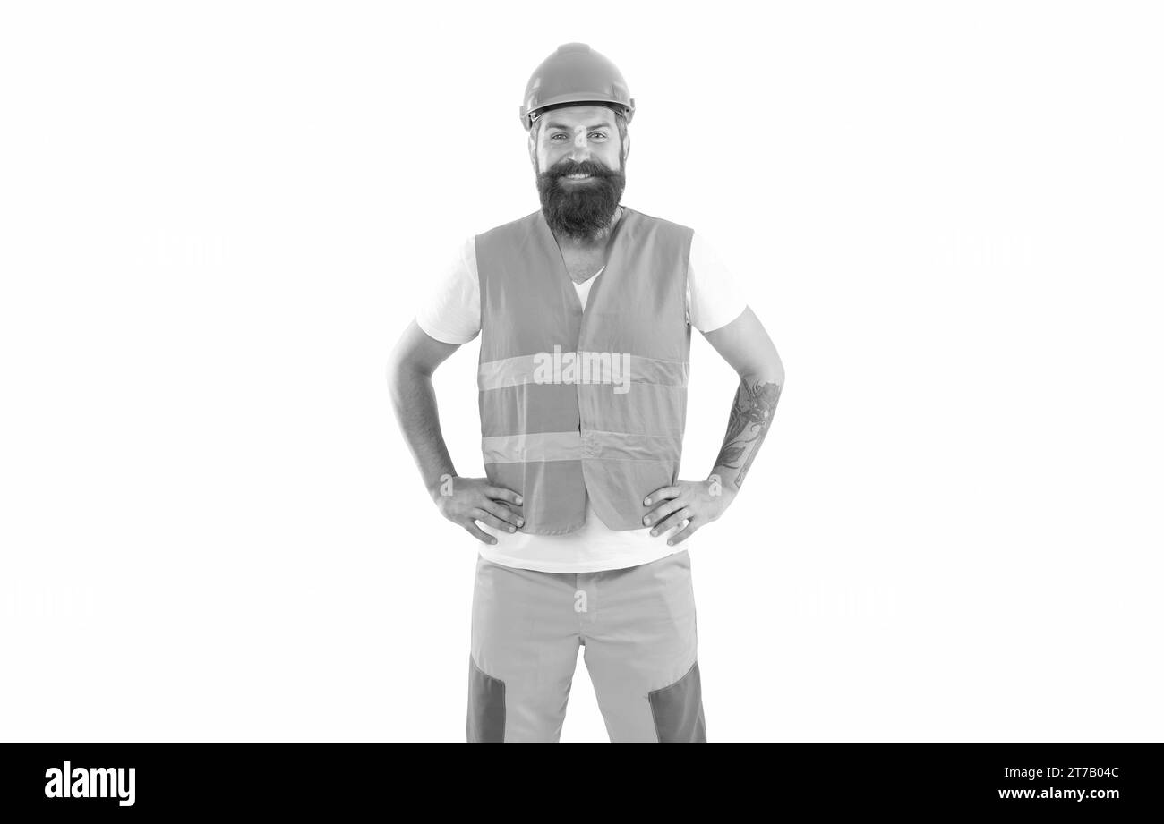 positive builder isolated on white background. builder man in uniform. bearded builder in orange vest. studio shot of builder wearing helmet. Stock Photo