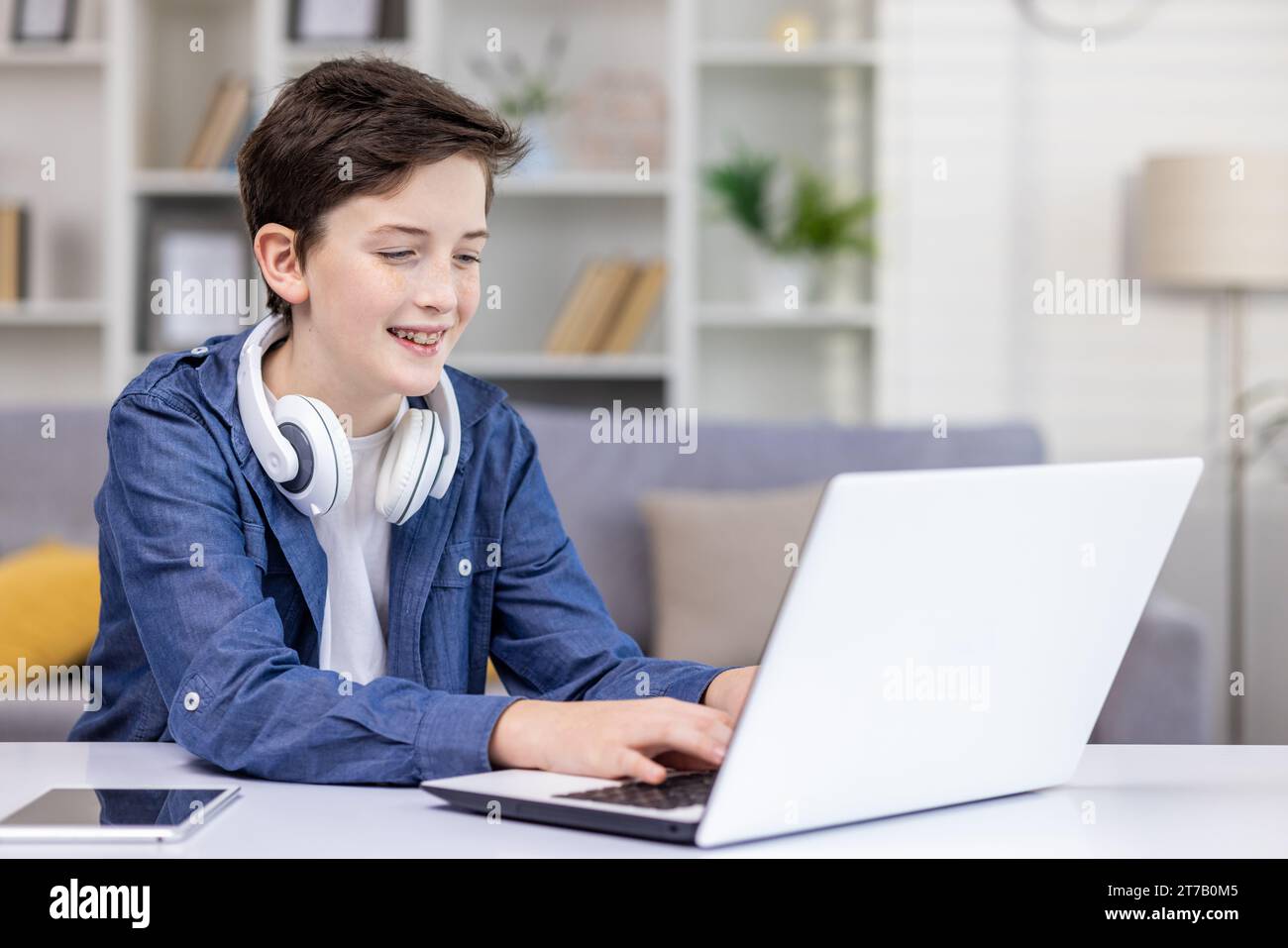 Teenage boy watching computer screen hires stock photography and