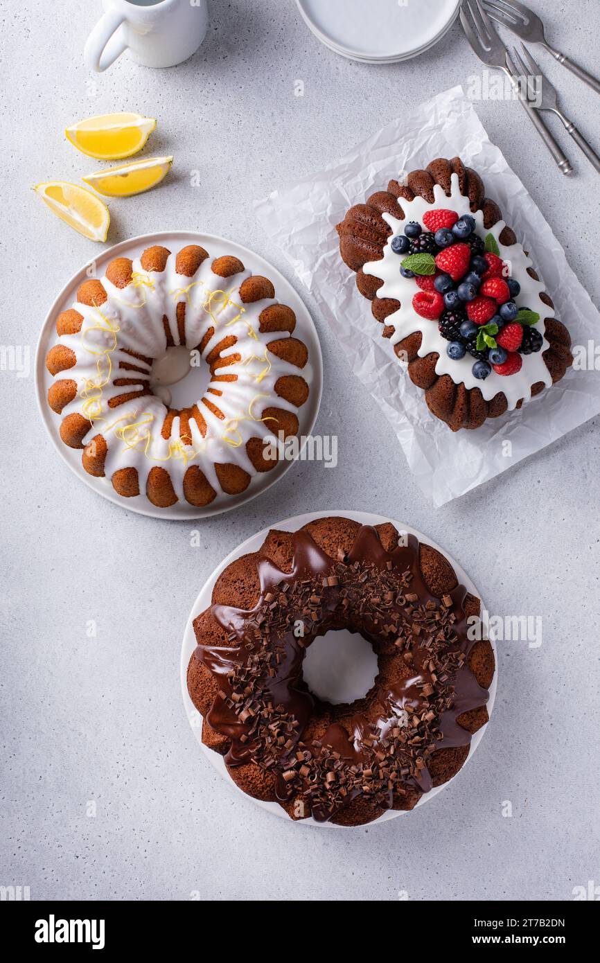 Variety of homemade bundt cakes and loaf cakes ready to eat overhead view Stock Photo