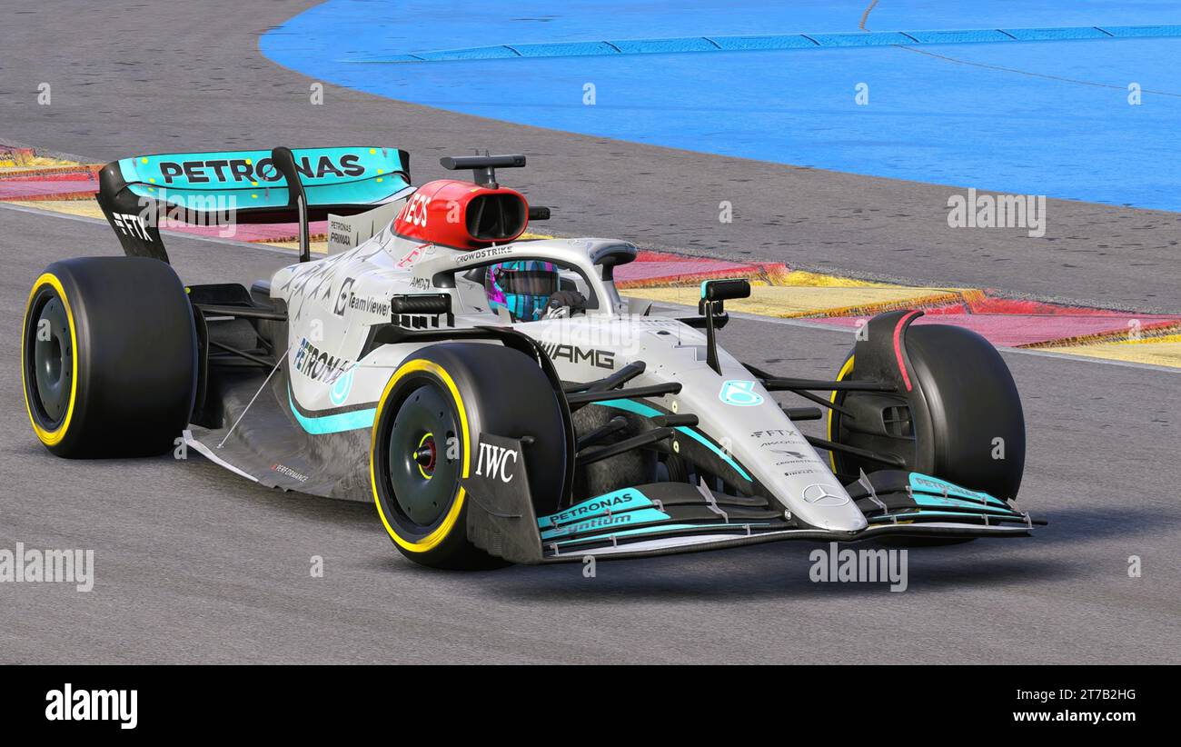 A high-speed Formula car racing along a track, illuminated by a bright ...