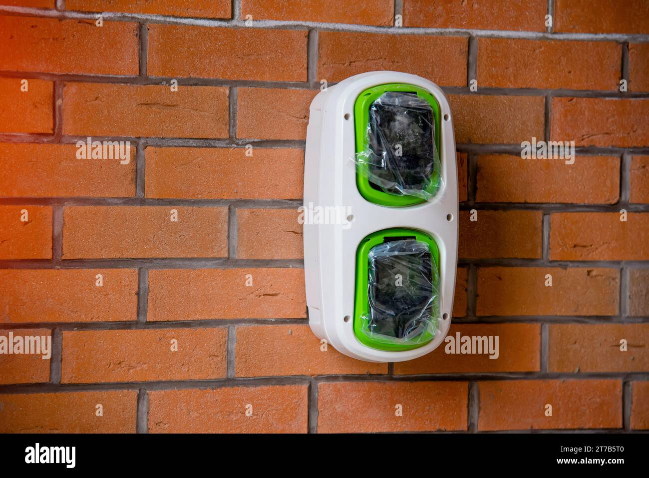 Electric vehicle domestic charging point installed outside of the house on new housing