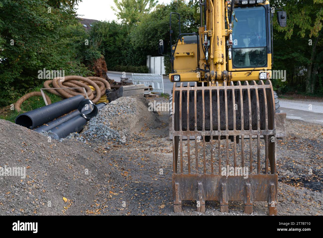 Front view of excavator bucket on construction site. Close up. Stock Photo