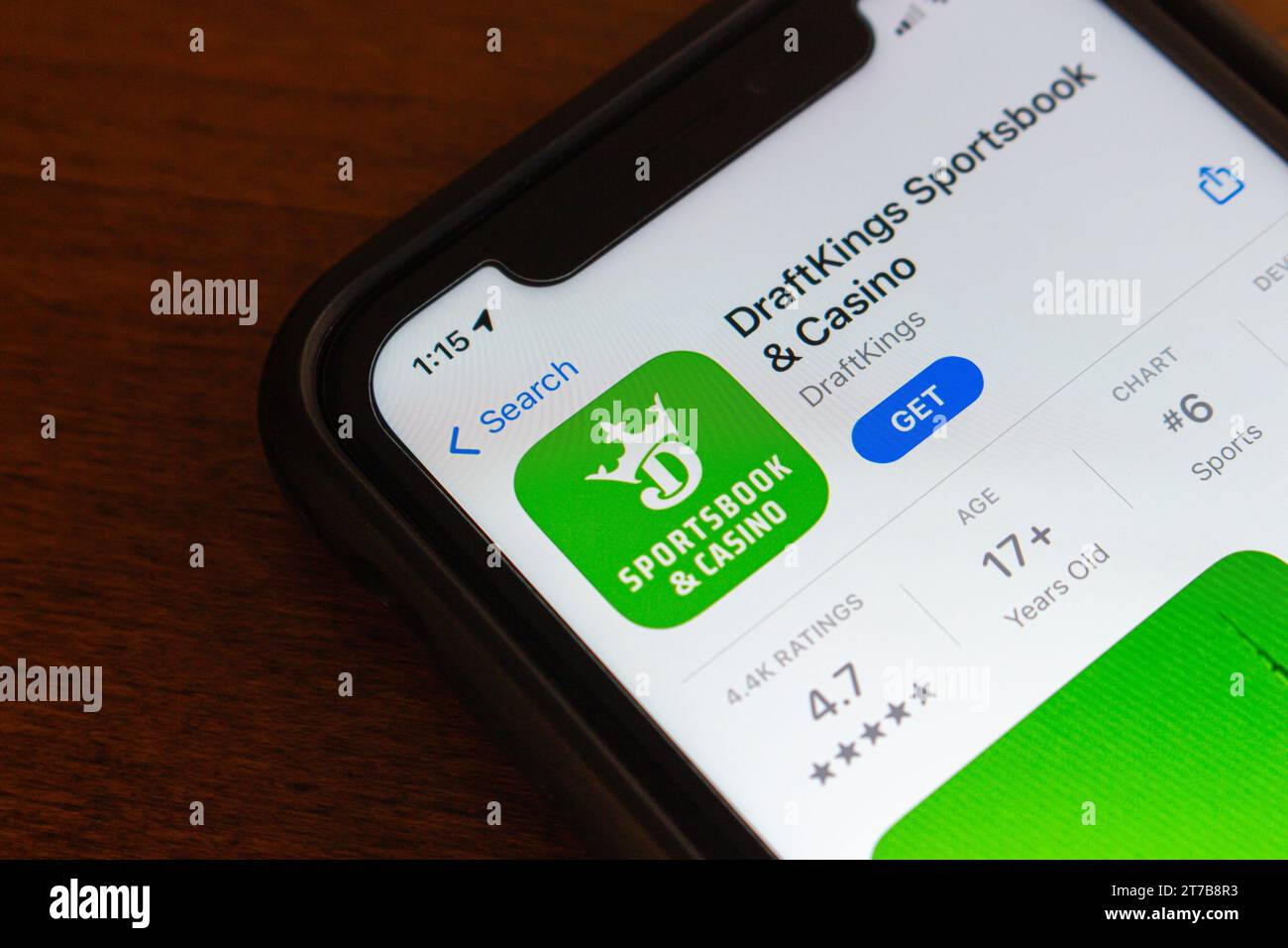 DraftKings app seen in App Store in iPhone screen. DraftKings is an US
