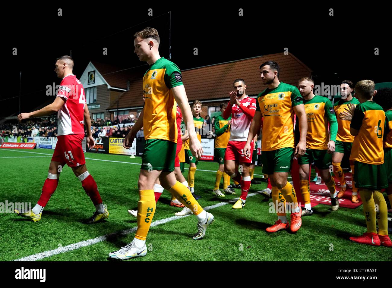 Horsham and Barnsley make their way to the field ahead of the Emirates FA Cup first round replay match at The Camping World Community Stadium, Horsham. Picture date: Tuesday November 14, 2023. Stock Photo