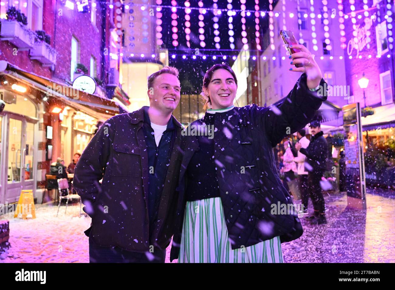 EDITORIAL USE ONLY Visitors Josh Sharland and Matilda Haymes take a selfie at 'St Christmas Place', a seven-week festive celebration and Christmas lights display at St Christopher's Place, London. Picture date: Tuesday November 14, 2023. Photo credit should read: Matt Crossick/PA Wire Stock Photo