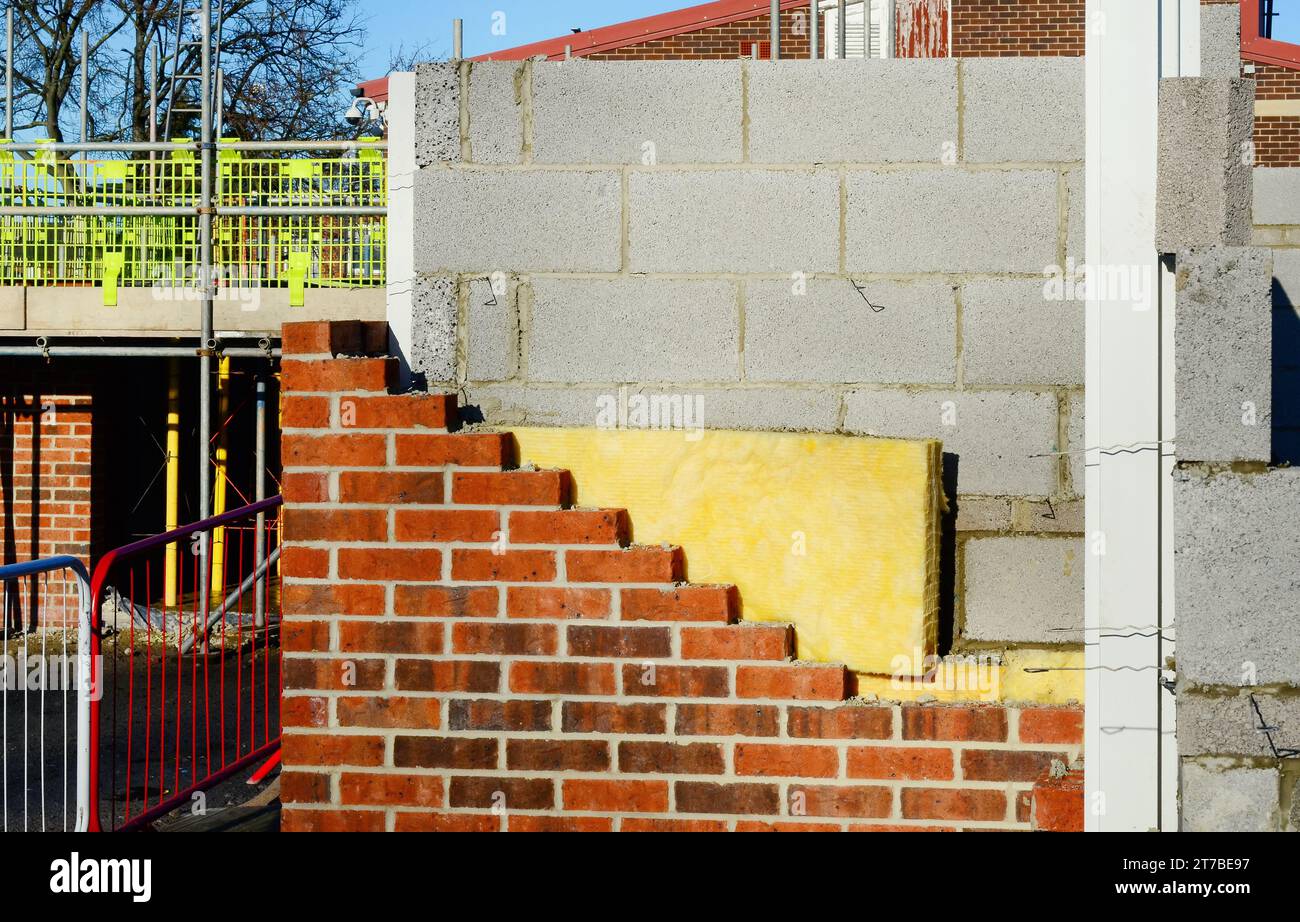 Insulating walls of new build houses by placing rock wool inside wall