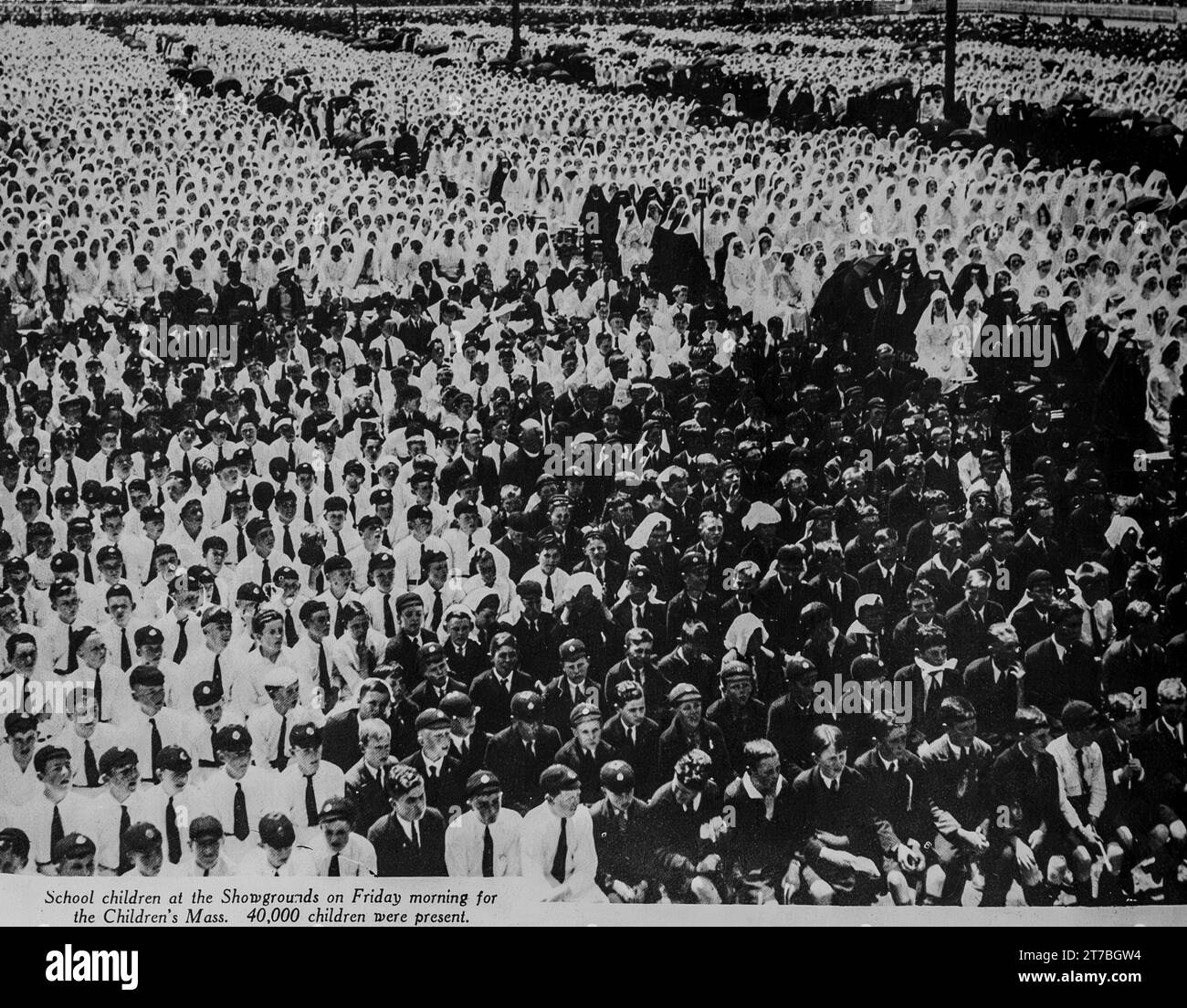 An image from the 1934 Eucharistic Congress in Melbourne, Australia. The image shows a section of the estimated 40,000 children who attended the Children’s Mass Stock Photo