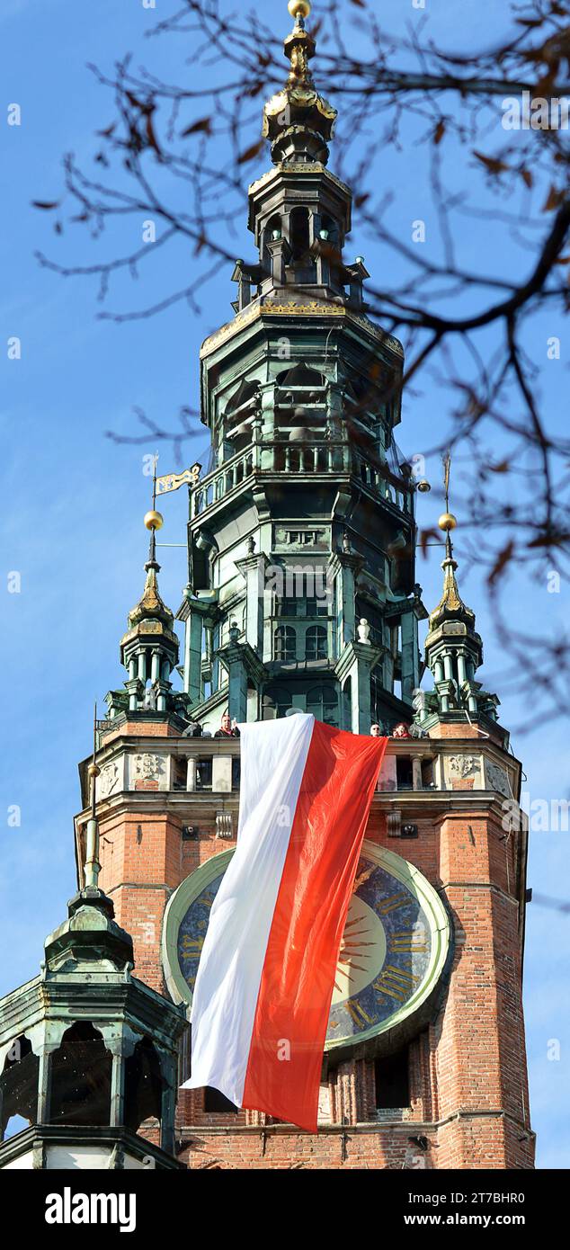 GDANSK, POLAND - 11 NOVEMBER 2023:The flag is waved from Gdansk Town Hall on Polish Independence Day. Stock Photo