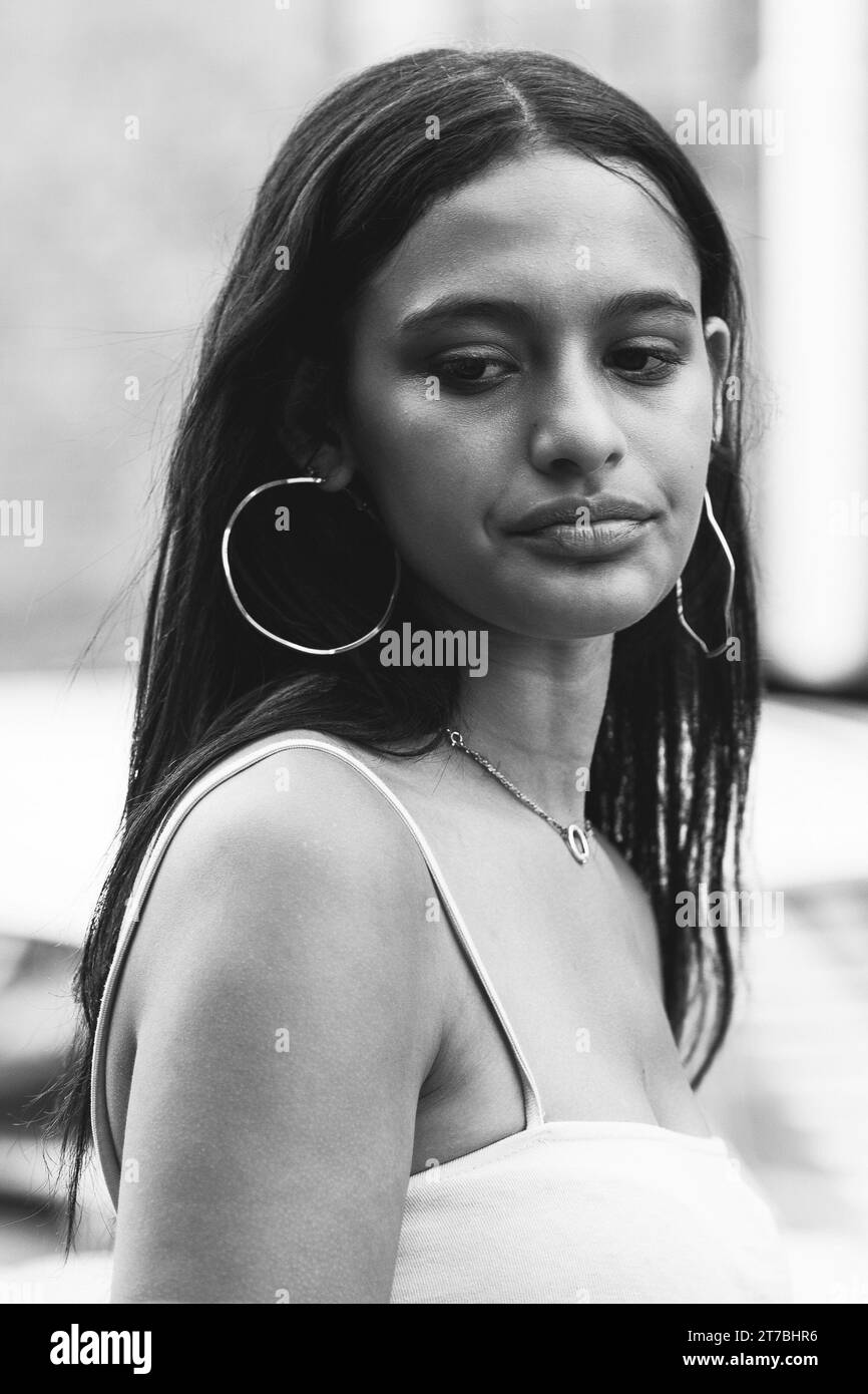 Black and white head and chest street portrait of a young South-African woman Stock Photo